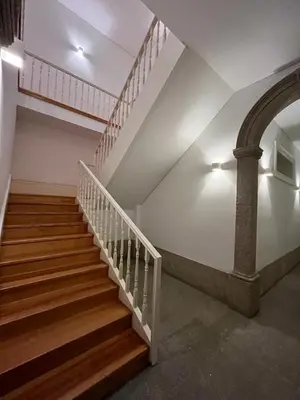 a staircase in a building with a stair case at Quiet, bright apt near Bolhão in Porto