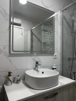 a kitchen with white cabinets and a sink and a stove at SP Douro Apartment in Vila Nova de Gaia