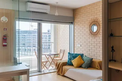 a bedroom with a bed and a mirror at Dragon View Watch the Game in Porto