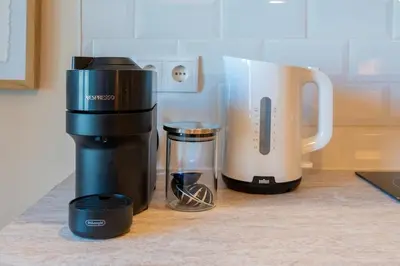a coffee maker and a blender on a counter at Douro Prestige Studio in Vila Nova de Gaia