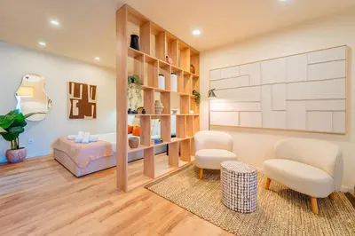 a living room with two chairs and a couch at Douro Prestige Studio in Vila Nova de Gaia