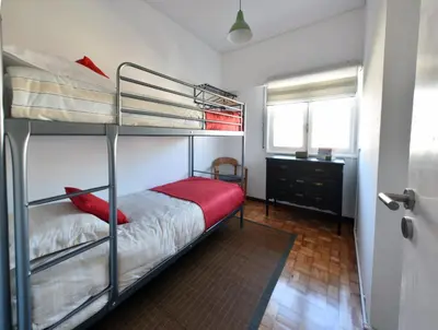 a bedroom with two bunk beds and a window at PinPorto City Center I in Porto