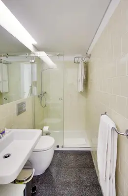 a bathroom with a shower and a toilet and a sink at Charming Apartments in Historic Centre - Inside Porto Apartments 
