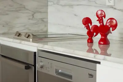 a kitchen counter with red figurines on top of it at Charming Apartments in Historic Centre - Inside Porto Apartments 