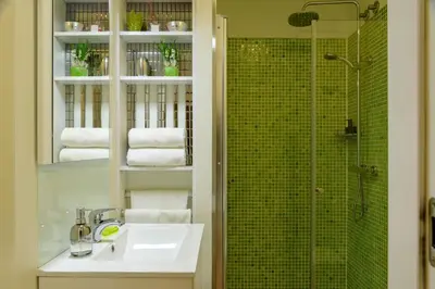a bathroom with a sink and a shower at Cativo Flat in Porto