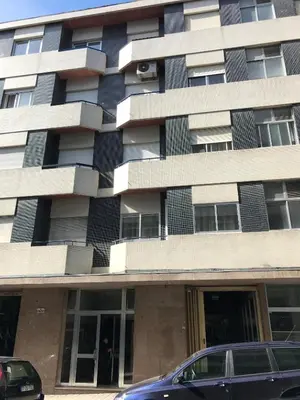 a building with a car parked in front of it at Sta. Catarina Home in Porto