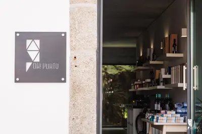 a store window with a sign that reads our product at Oh! Porto Apartments in Vila Nova de Gaia
