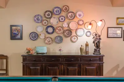 a wall with a bunch of plates on the wall at Charming Antas House in Porto