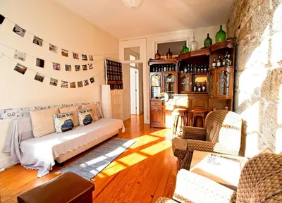 a living room with a couch and a fireplace at Ribeira Smart Flat in Porto