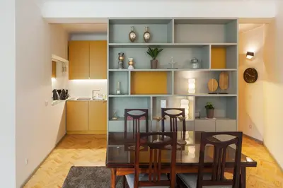 a kitchen and dining room with a table and chairs at CdC Apartments by Casa do Conto in Porto