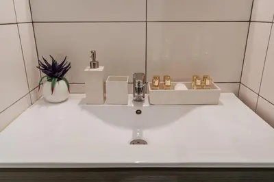 a white sink in a bathroom with at Authentic Porto Apartments in Porto
