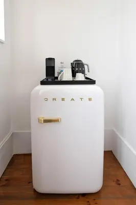 a white refrigerator with a coffee maker on top of it at Oporto Comfort Charming Cedofeita - Free Parking in Porto