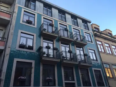 a building with balconies on the side of it at I love alegria in Porto