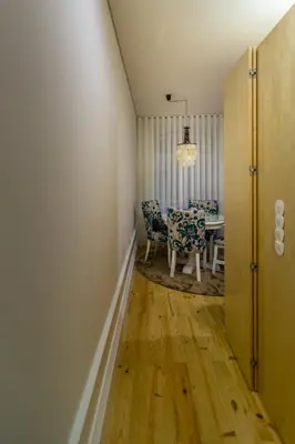 a dining room with a table and chairs in a room at Casa d'Alma by Oporto Soul in Porto