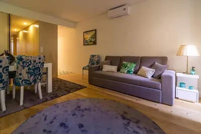 a living room with a couch and a table at Casa d'Alma by Oporto Soul in Porto