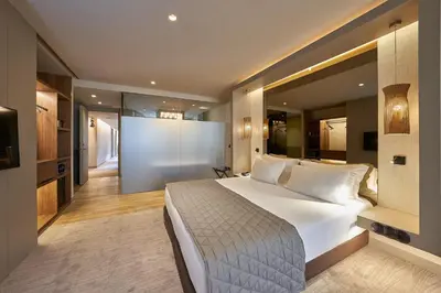 a bedroom with a large white bed in a room at PortoBay Teatro in Porto