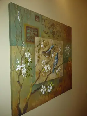 a painting of a bird on a tree with flowers at ML Apartments Story in Porto