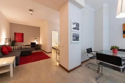 a living room with a couch and a table at BmyGuest - Santa Catarina Downtown Apartment in Porto
