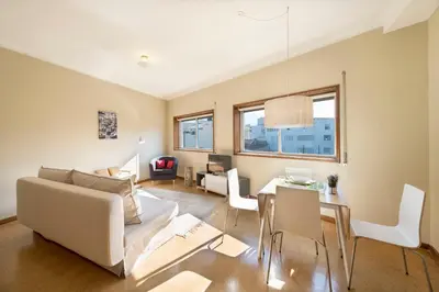 a living room with a couch and a table at BmyGuest - Santa Catarina Light Apartment in Porto