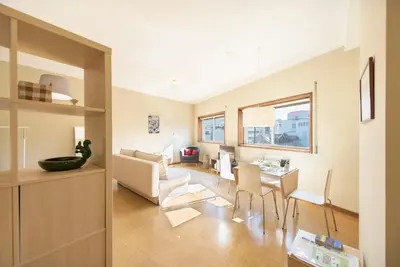a living room with a couch and a table at BmyGuest - Santa Catarina Light Apartment in Porto