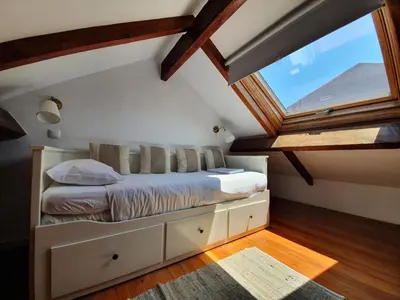 a bedroom with a bed with a large window at Porto Alegria Garden in Porto