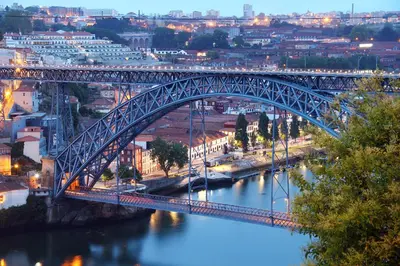 a bridge over a river with a city at BmyGuest - Cardosas Stylish Apartment in Porto