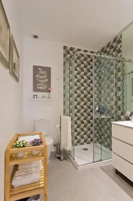 a bathroom with a shower and a toilet and a sink at Oporto Golden View Ribeira in Porto