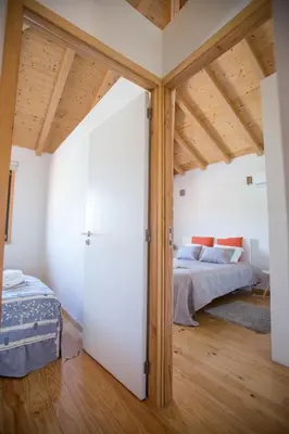 a bedroom with a bed and a wooden ceiling at LivingPorto Apartments by Porto City Hosts in Porto