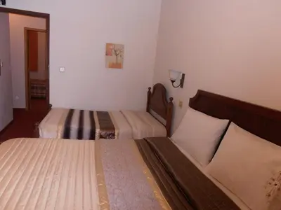 a room with two beds in a room at Hotel S. Marino in Porto