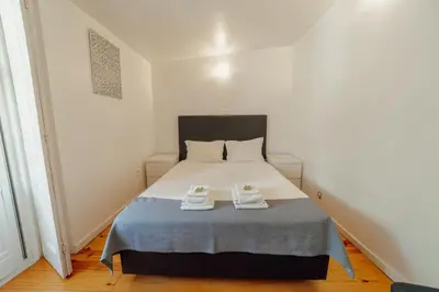 a bedroom with a bed with two towels on it at Dear Porto By Hosty in Porto