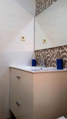 a kitchen with a sink and a tile wall at D&S - Crocodile House S. Bento Apartments in Porto