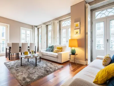 a living room with a couch and a table at Cardosas Boutique Apartment in Porto