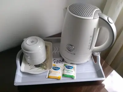 a coffee maker and a blender on a shelf at Hotel Mira D'Aire in Porto