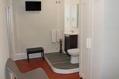 a bathroom with a toilet and a sink at Lunar Guest House in Porto