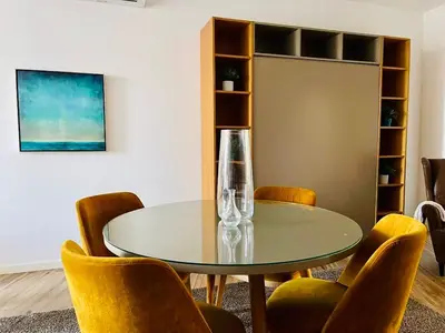 a dining room with a glass table and chairs at Oporto Chic & Cozy - Bolhão in Porto
