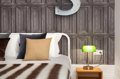 a bedroom with a white bed with a green lamp at Oporto Chic & Cozy - Bolhão in Porto