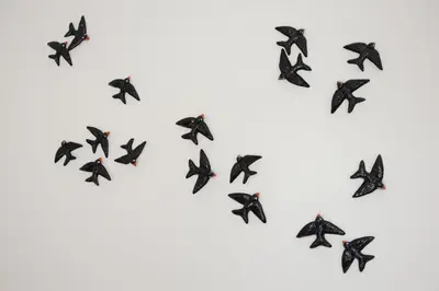a flock of black birds flying in a heart formation at Oporto Chic & Cozy - Bolhão in Porto