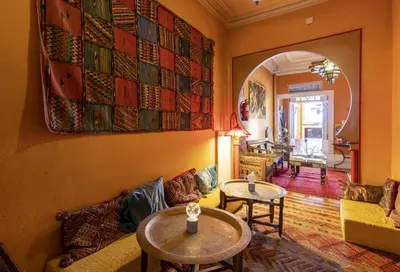 a living room with a couch and a table at Porto Riad - Guest House in Porto