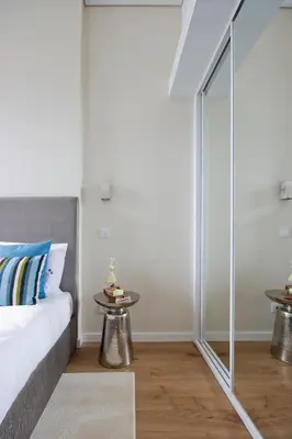 a bedroom with a bed and a mirror at OHH -Porto 4 you- Deluxe Apartment With Free Parking in Porto