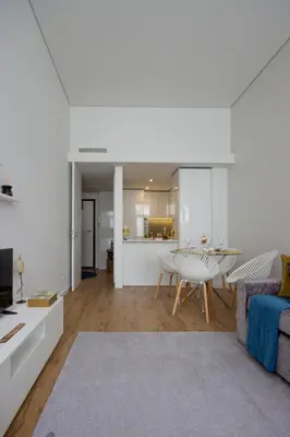 a living room with a table and a couch at OHH -Porto 4 you- Deluxe Apartment With Free Parking in Porto