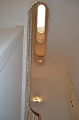 a stairway with a window and a stair case at Apartamento LM Ribeira in Porto