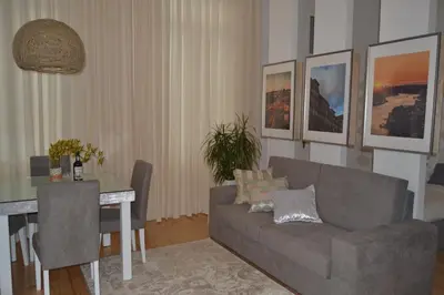 a living room with a couch and a table at Apartamento LM Ribeira in Porto