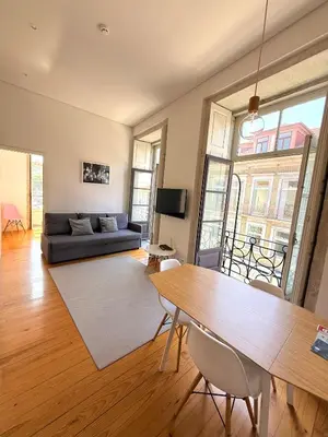 a living room with a couch and a table at Porto Cinema Apartments in Porto
