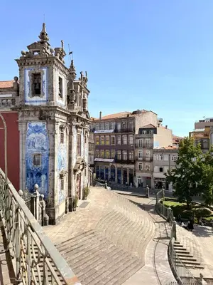 an old building with a staircase in a city at Porto Cinema Apartments in Porto