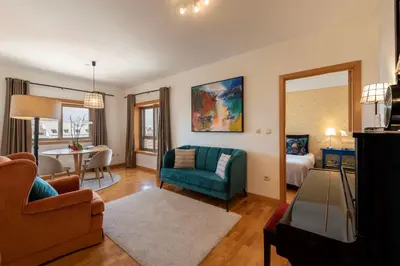 a living room with a couch and a table in a room at BBA Apartments Boavista - Casa da Música with free parking in Porto
