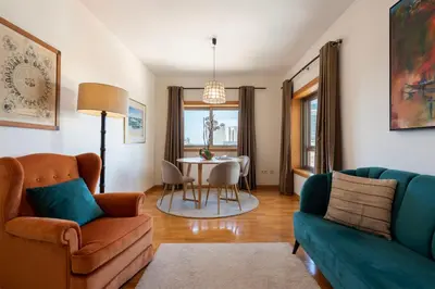 a living room with a couch and a table at BBA Apartments Boavista - Casa da Música with free parking in Porto