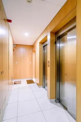 an empty hallway with glass doors in a building at BBA Apartments Boavista - Casa da Música with free parking in Porto