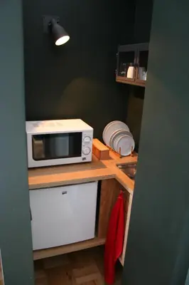 a kitchen with a microwave on a counter at 2U Oporto Urban Stays in Porto