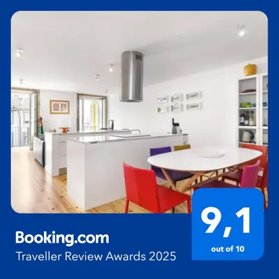 a white kitchen with a table and chairs at SBV Perfect River View in Porto
