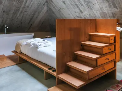 a bedroom with a bed and a bath tub at Armazém Luxury Housing- Architectural & Design Hotel in Porto